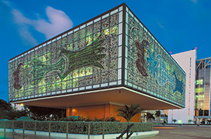 Located in the plaza behind the Miami tower, the Bacardi Imports Annex was designed by Miami architect Ignacio Carrera-Justiz in 1973. The glass walls—based on four commissioned artworks by the German abstract artist Johannes Maria Dietz—feature figures of bats and illustrate the conversion of sugar cane into rum.BACARDI ARCHIVE 