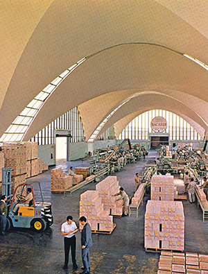 Spanish émigré Félix Candela led a team of Mexican architects and engineers in his second commission for Bacardi—a modernist distillery built in Tultitlán outside of Mexico City, 1960–1961. The design incorporated a large variety of concrete-shell structures, including this cavernous groin-vaulted bottling hall, that were inspired by the recently completed Lambert-St. Louis Airport Terminal.  BACARDI ARCHIVE