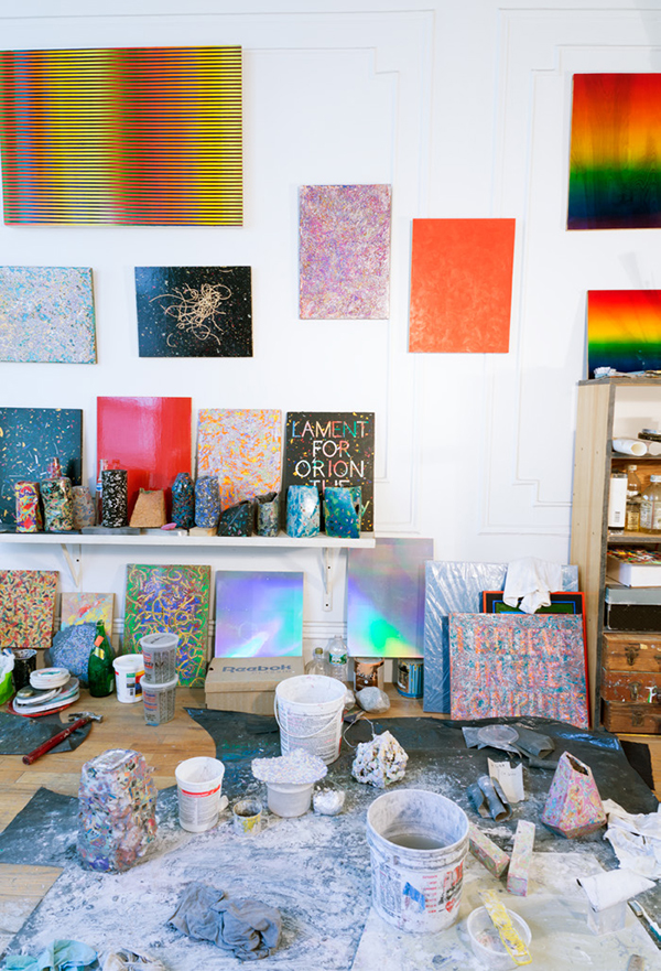 In Parker’s Bushwick studio, his brightly colored paintings and vessels line the wall while pieces in various stages of completion, and the materials used to create them, are spread out across the floor, revealing his creative process. | COURTESY DAMON CRAIN