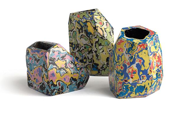 Three vessels from the Lacarazzo series, 2015: The Dustbuster Turns 30, dyed and pigmented cement with embedded brass and other materials, and resin, wax, and lacquer finish; “The House You Live In”: B-Side to Gordon Lightfoot’s “The Wreck of the Edmund Fitzgerald,” dyed and pigmented cement with embedded aluminum, brass, and other materials, and wax and lacquer finish; Poussin’s Abduction of the Sabines, dyed and pigmented cement with embedded brass and other materials, rubber lining, wax and oil finish. | COURTESY DAMON CRAIN