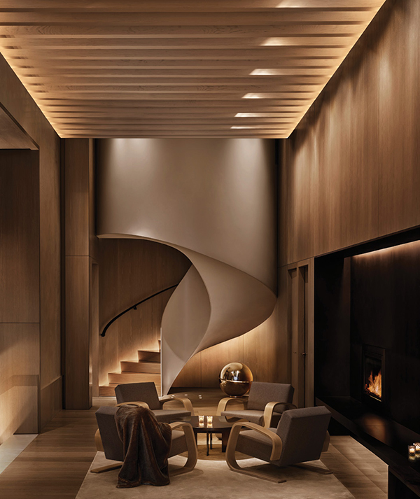 David Rockwell designed the New York Edition, a hotel by Ian Schrager in partnership with Marriott International, in the Metropolitan Life Tower—revamping the historic interior of the 1909 Gothic-style building. Featured here is the lobby’s striking spiral steel stair, paneled with light oak. |NIKOLAS KOENIG PHOTO