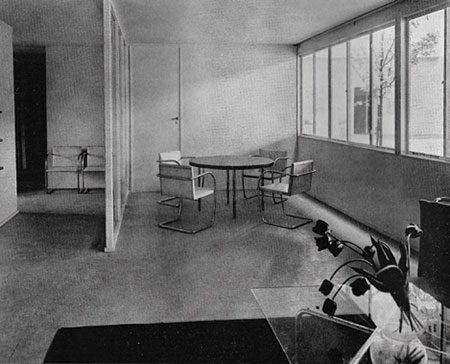 “House for a young married couple” designed by Carl Otto and Ruhtenberg for the German Building Exposition, Berlin, 1931, from Arts & Decoration, July 1934. Pictured is the dining corner as seen from the livingroom area, with a table by Ruhtenberg surrounded by Brno armchairs by Mies van der Rohe. Ruhtenberg and Otto were awarded a gold medal for the design. 