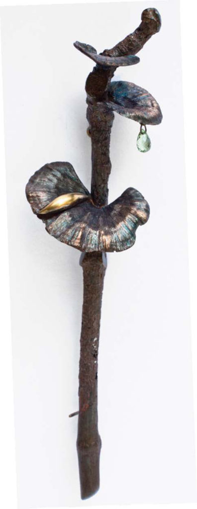 Kiss’s 2012 mushroom brooch is made of bronze, 18- and 14-karat gold, and sapphire. LIZA MACRAE PHOTO (2)
