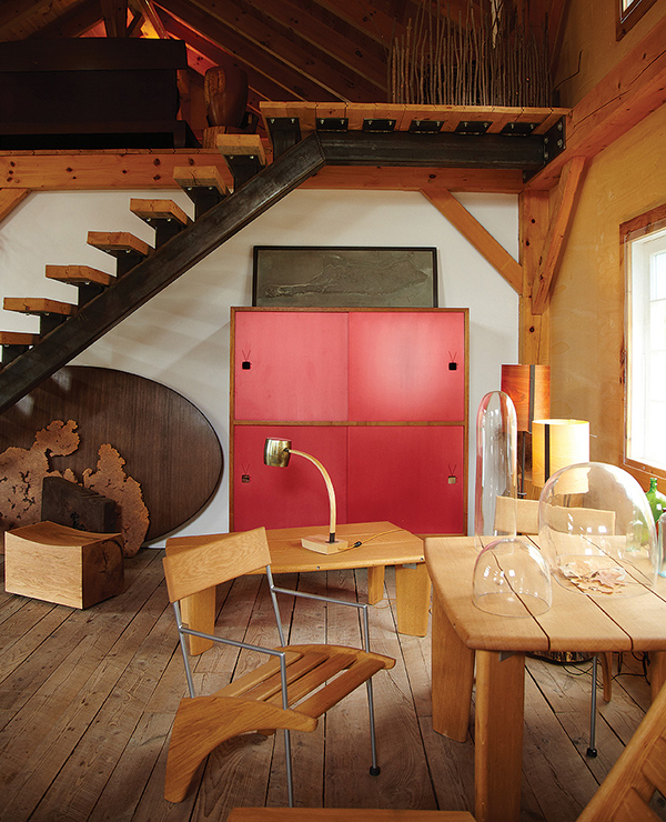 Chris Lehrecke’s studio in Bangall, New York, contains an assortment of his furniture, including a cabinet with red anodized aluminum doors, outdoor tables, and chair prototypes made from white oak, as well as some of his lighting designs. The stairway, custom made by his metal fabricator Stewart Verrilli from salvaged hemlock and steel, leads to Lehrecke’s office. DAN HOWELL PHOTO
