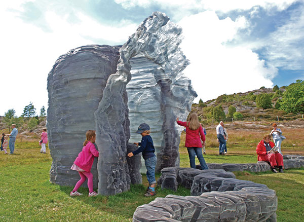 Children playing in Damski Czepek, 2006, as installed at Pilane in Sweden in 2009. The work is now installed at the Yorkshire Sculpture Park. | PETER LENNBY PHOTO, © URSULA VON RYDINGSVARD, COURTESY OF GALERIE LELONG