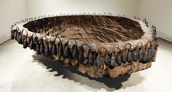 The rim of Ocean Floor, 1996, is encircled by pairs of sewn cow’s intestines. Describing stitching the organic material, von Rydingsvard says, “It’s soft while I’m sewing it, so it’s fresh, and then it dries, becoming something else entirely.” | JASON MANDELLA PHOTO, © URSULA VON RYDINGSVARD, COURTESY OF GALERIE LELONG