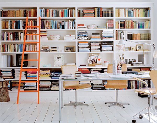 Reading is an essential part of Holm family life. In the library/study are (besides floor-to-ceiling books) two Oxford chairs and a Series 7 chair, all by Arne Jacobsen. The ladder is by the young Danish designer Cecilie Manz. The table is Plano by Pelikan Design for Fritz Hansen. | Photography by GAELLE LE BOULICAUT