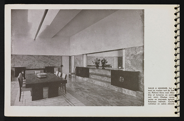 The parents’ dining room, as seen in another photograph from Une demeure 1934, is lined with Swedish green marble and had furniture in varnished blackened pearwood, though the room remains unfurnished today. The suspended luminaire, made in the artificial stone known as staff, was designed by Mallet- Stevens in collaboration with André Salomon. | ROBERT MALLET-STEVENS—ADAGP/©PHILIPPE BERTHÉ-CMN