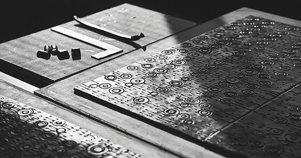 Engraving in process for Donat’s Banc Tribal and the finished piece, 2014, in bronze and leather. | COURTESY CARPENTERS WORKSHOP GALLERY