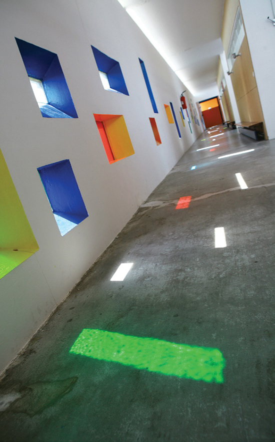 Interior views of the housing unit show the play of light through its colored windows on the “internal streets” linking the apartments. | HUBERT GENOUILLAC/PHOTUPDESIGN, COURTESY FONDATION LE CORBUSIER