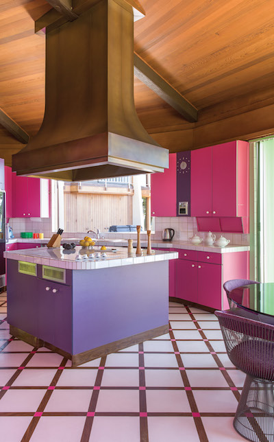 After much debate, the Loughreys decided to keep the original hot pink and purple kitchen that echoes the colors of the sunset, a fun counterpoint to the subtle material palette of the rest of the interior. | Photography by Stephan Julliard