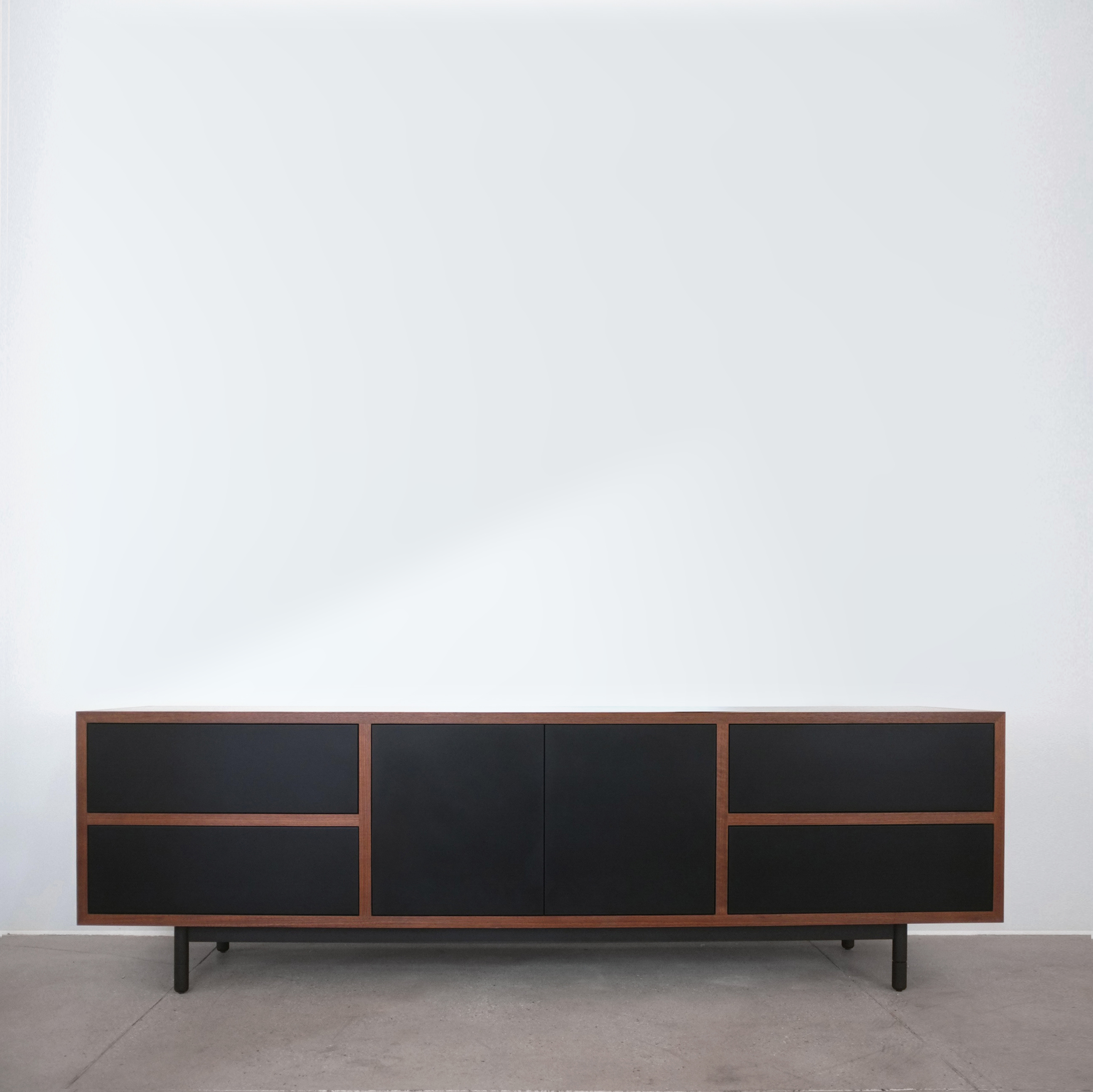 Driver Console by Bellboy in American walnut, paper composite, and blacked steel. 