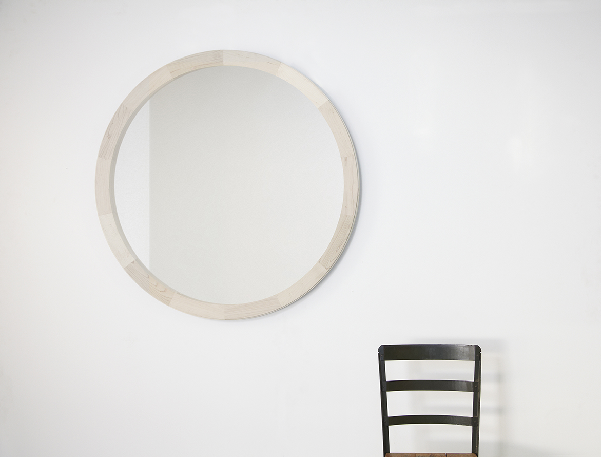 Cirque Mirror by Bellboy in walnut, white oak, and bleached maple.