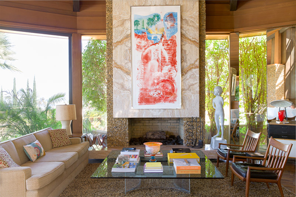 Robert Rauschenberg’s Sky Garden hangs above the fireplace in the living room. To the right are a Tim Hawkinson sculpture, two John Nyquist lounge chairs, and a Charles Eames Storage unit, on which stands a Mitchell Bobrick table lamp. | Photography by Stephan Julliard