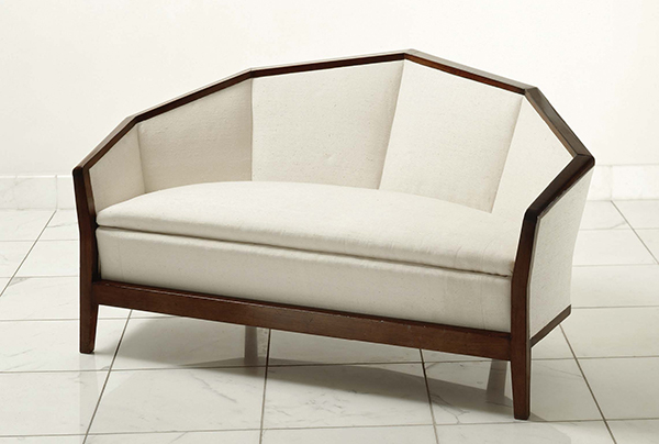 Rosewood-trimmed sofa designed by Chareau, c. 1923. | COURTESY GALERIE KARSTEN GREVE, PARIS