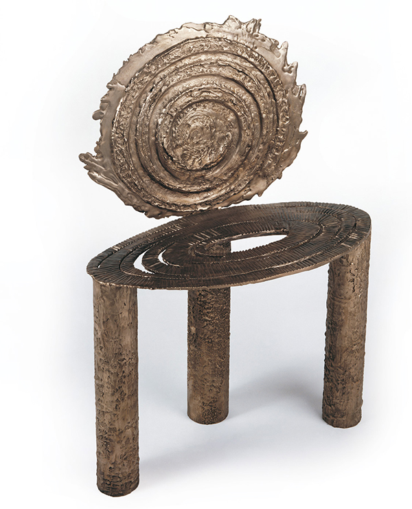 This three-legged chair in cast and patinated bronze, c. 1990, has a spiraling seat and shield-like back, reminiscent of images of meteors and the galaxy | JOSEPH COSCIA JR. PHOTO