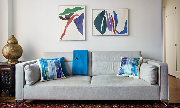 The pillows were custom designed for the Ligne Roset couch. Above hang two untitled color lithographs by Ray Parker. | Photography by MARK ROSKAMS