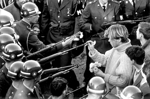 ARLINGTON, VA - OCTOBER 26 1967: Antiwar demonstrators tried flower power on MPs blocking the Pentagon Building in Arlington, VA on October 26, 1967. (Photo by Bernie Boston/The Washington Post via Getty Images)