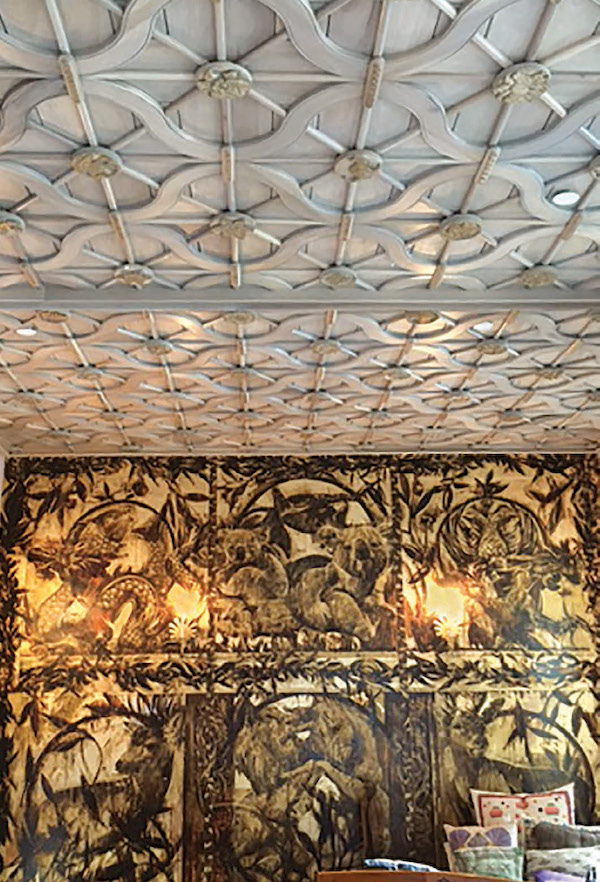 In one upstairs bedroom, the carved wooden ceiling with latticework and medallions was copied and adapted from an eighteenth-century Polish synagogue. The woodworking was done by Handshouse Studio based in Norwell, Massachusetts. Artist Ben Tritt painted the mural with references to Australia, where Pletka grew up. Courtesy Irene Pletka