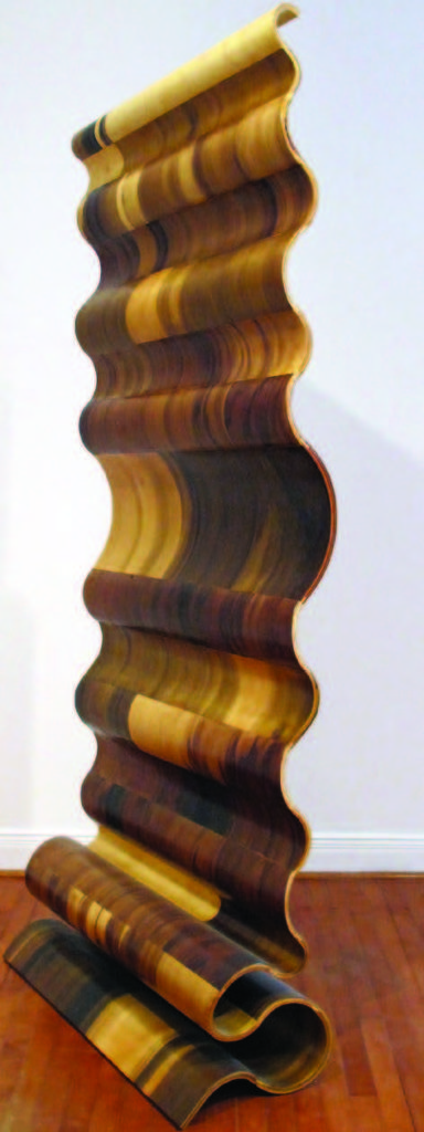 Vertical Wave by Susan Woods, known as Aswoon, 2014, in bent poplar plywood is on view at Wexler Gallery. WEXLER GALLERY